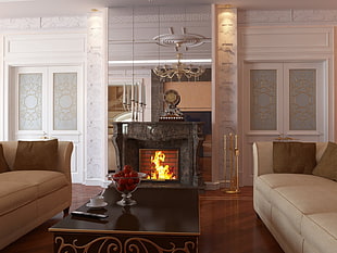rectangular brown wooden coffee table in between of brown and beige sofas near the fireplace