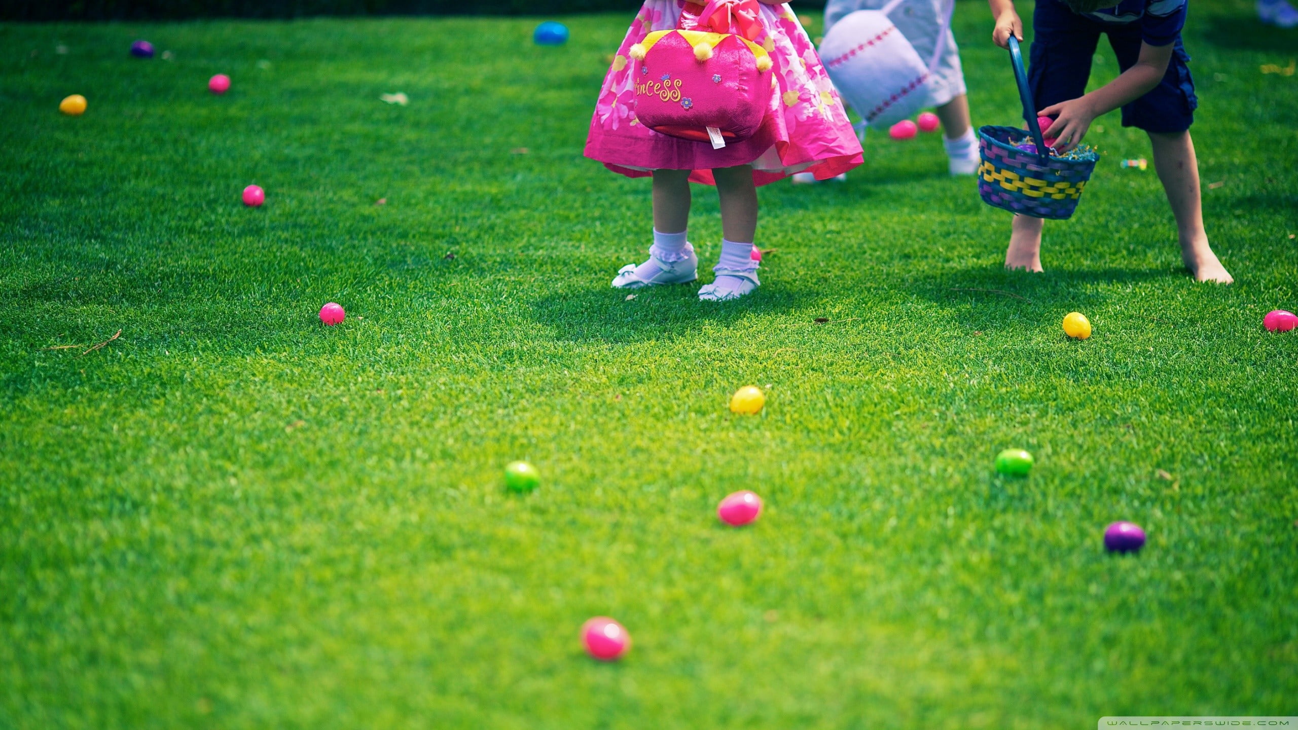 pink and purple plastic toy, grass