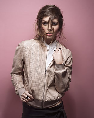 woman wearing brown leather zip-up jacket