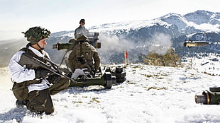 man holding steyr aug rifle while kneeling, Steyr AUG , Austria, military, mountains