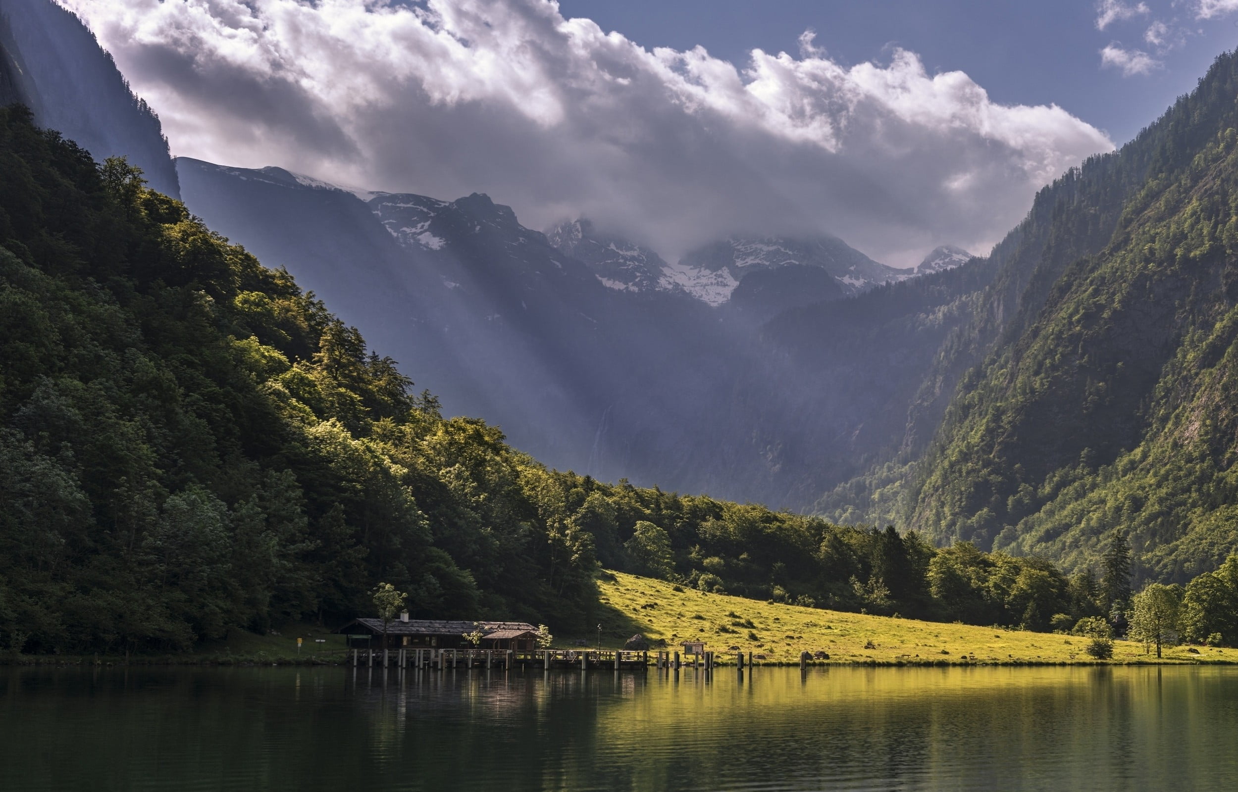 body of water in front of mountain