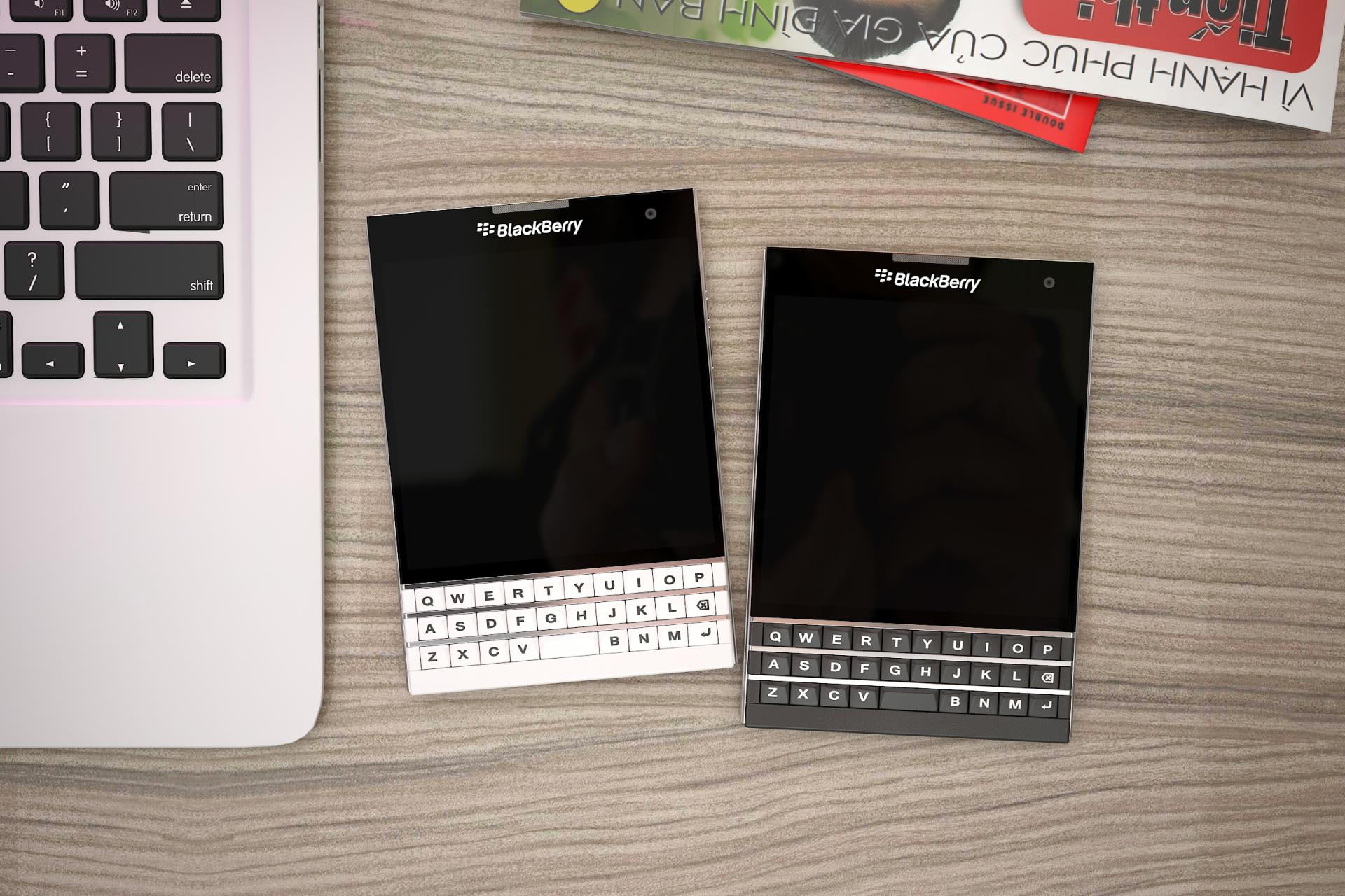 photo of two black Berry QWERTY phones on table