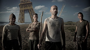 four men wearing assorted-color tops and bottoms with Eiffel Tower background illustration
