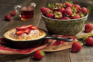 strawberry cake and strawberries on brown wooden table