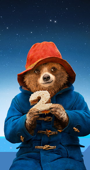 bear wearing blue jacket with red hat holding number 2 craved sandwich
