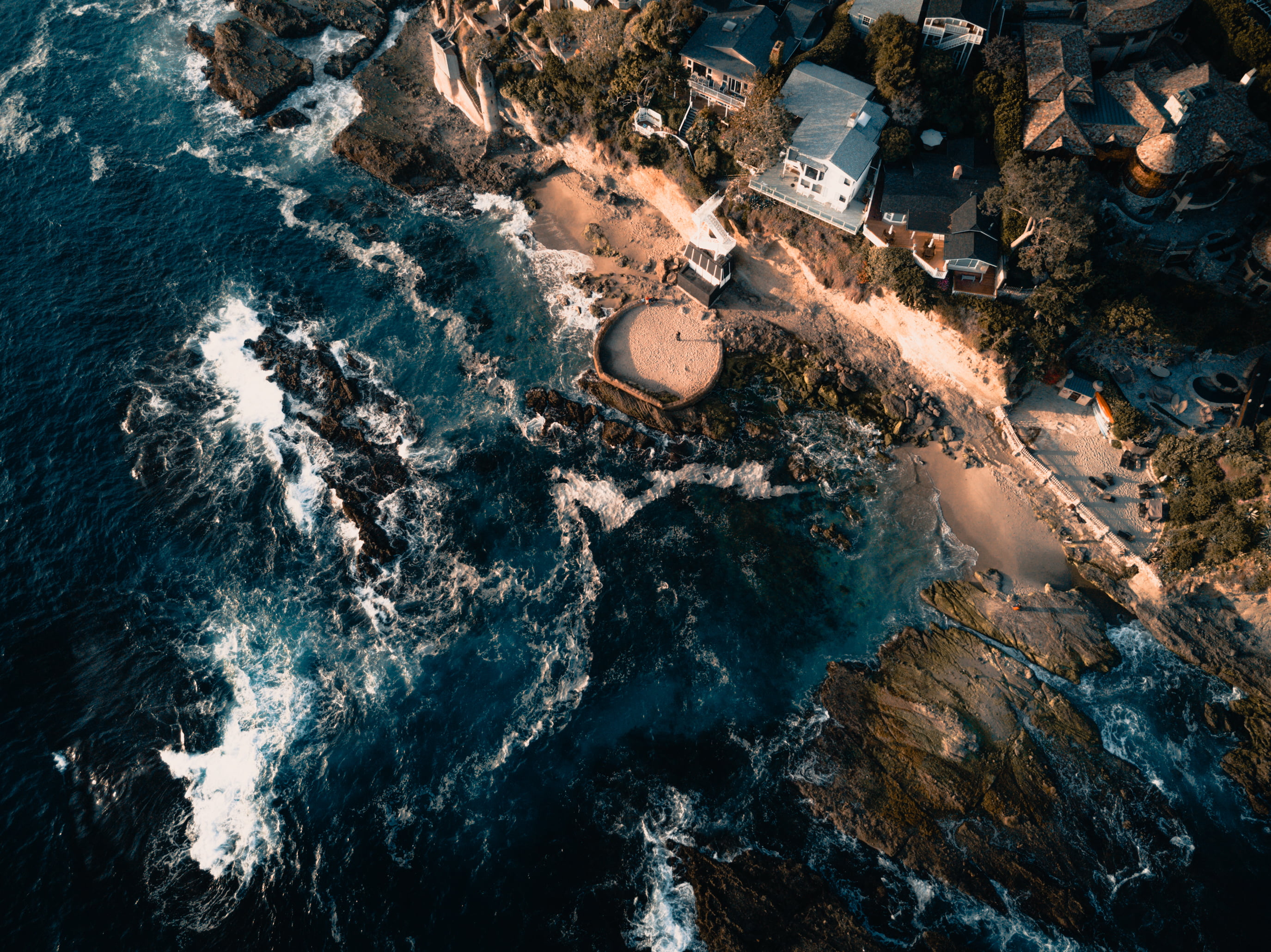 aerial photo of white houses beside seashore