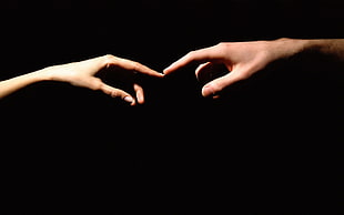 two fingers touching at the point of their index fingers HD wallpaper