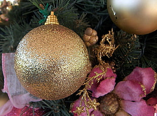 closeup photo of gold Christmas baubles