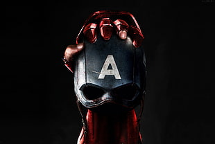 Iron Man holding Captain America Mask digital wallpaper