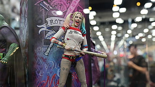 selective focus photography of Harley Quinn figurine