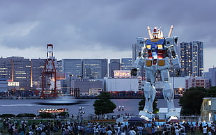 white and blue Gundam statue, photography, water, urban, city