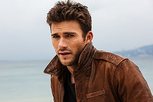man wearing brown leather jacket