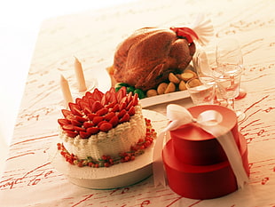 roaster chicken beside strawberry cake