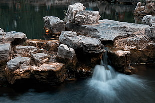 white and brown concrete bricks, water, lake, stones, waterfall