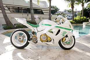 white and green sports bike