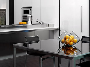 rectangular glass top dining table set with orange fruits