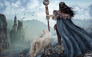 female shaman standing on cliff beside white wolf