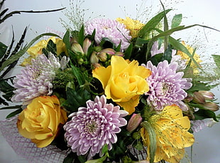 yellow and pink petaled flowers bouquet