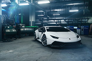 white Lamborghini Aventador inside factory