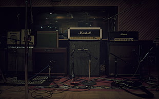 black Marshall  guitar amplifier and speakers