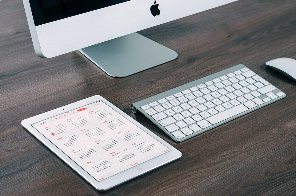 closeup photo of Apple wireless keyboard and mighty mouse on brown surface HD wallpaper