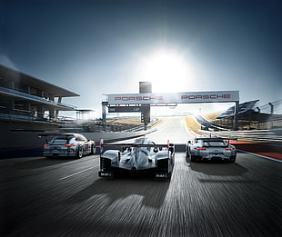 three racing car on track