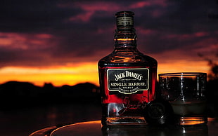 Jack Daniel's SIngle Barrel bottle beside shot glass HD wallpaper