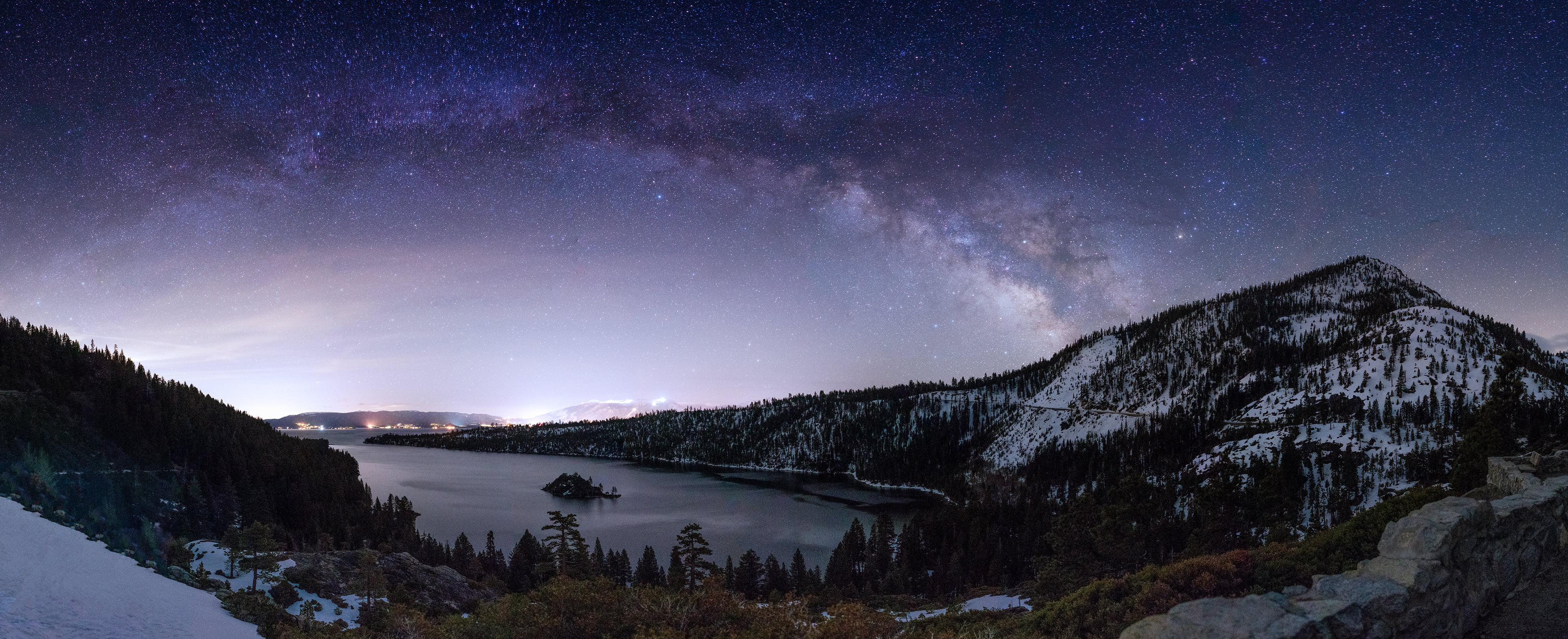 snow mountain with trees near water at night time, lake tahoe