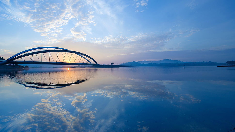 mirror photography of bridge and body of water during golden hour HD wallpaper