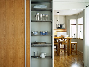 ceramic home decor in curio cabinet