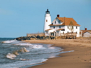 white lighthouse, shoreline, sea, lighthouse HD wallpaper