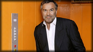 man wearing black suit jacket