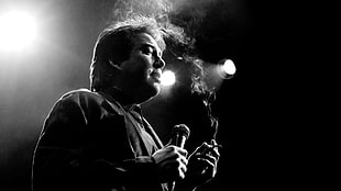 man with microphone and cigarette