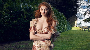 woman wearing beige and red floral dress