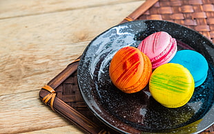 four macarons on black plate, sweets, food HD wallpaper