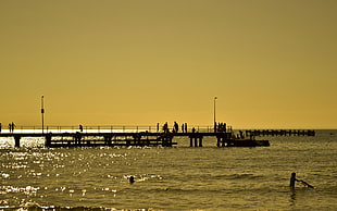 black metal dock, beach, sunset, silhouette, photography
