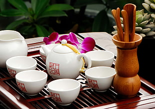 white ceramic tea set on brown wooden tray