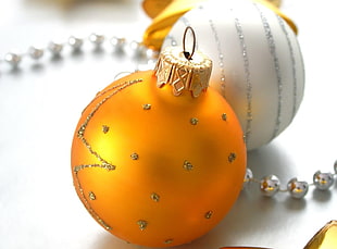 closeup photo of yellow Christmas bauble