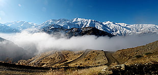 aerial photo of mountain covered with clouds