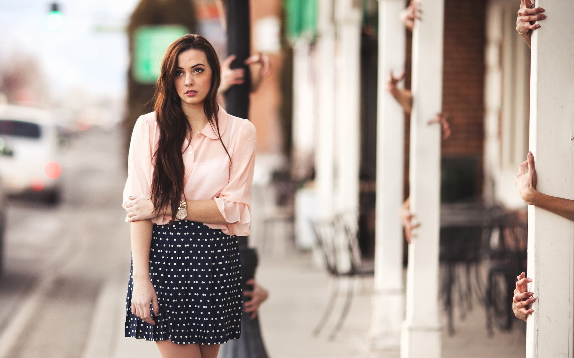 woman wearing white bell-sleeves blouse with black and white polka skirt