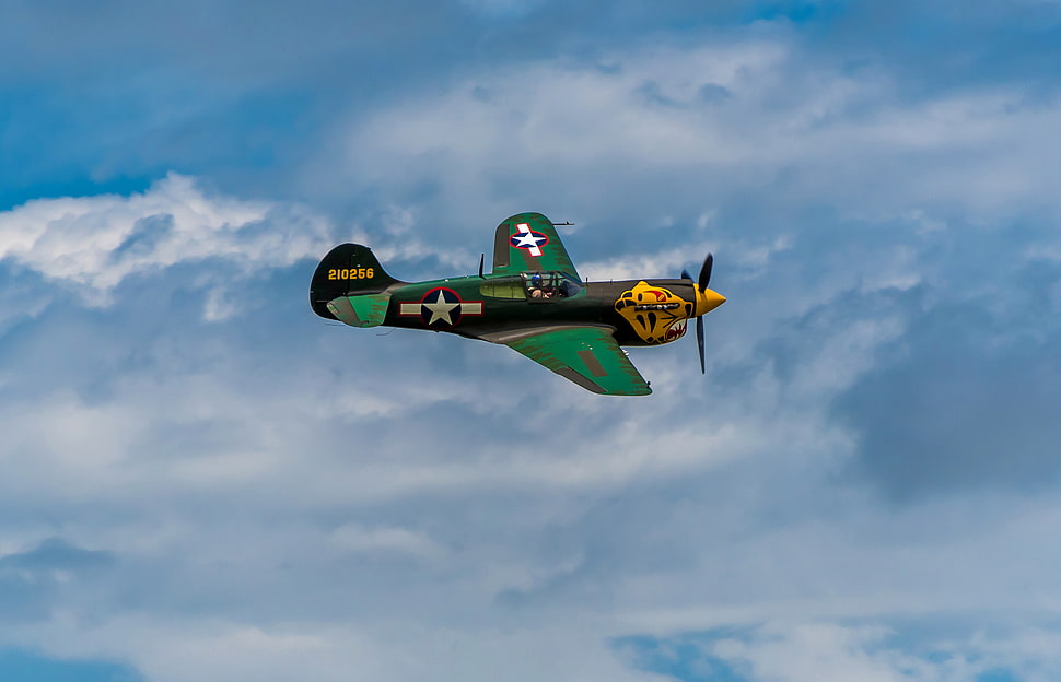 green and yellow plane flying HD wallpaper