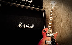 brown and red les paul electric guitar beside black Marshall guitar amplifier HD wallpaper