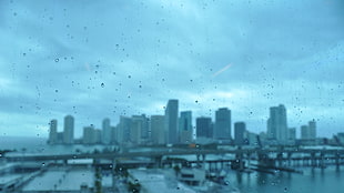 silhouette of buildings, city, rain, water drops, cityscape HD wallpaper
