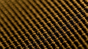 black and brown area rug, gold, macro, depth of field, abstract