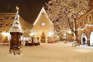 white painted buildings, snow, lights, city, Christmas