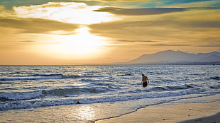 man on beach long exposure photography HD wallpaper