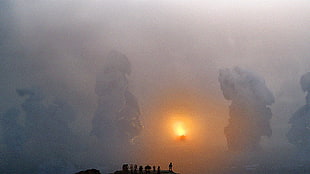 silhouette of people and smoke