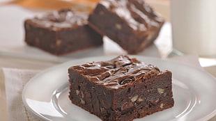 square sliced brownies on white ceramic plate