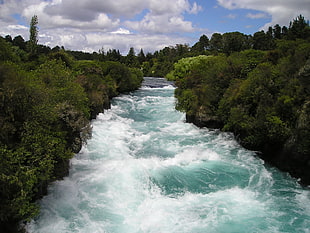 flowing water leading to river during daytime HD wallpaper