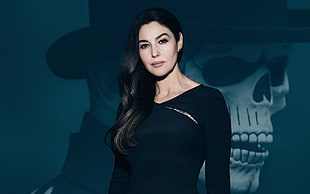 woman in black long-sleeved shirt with skull background